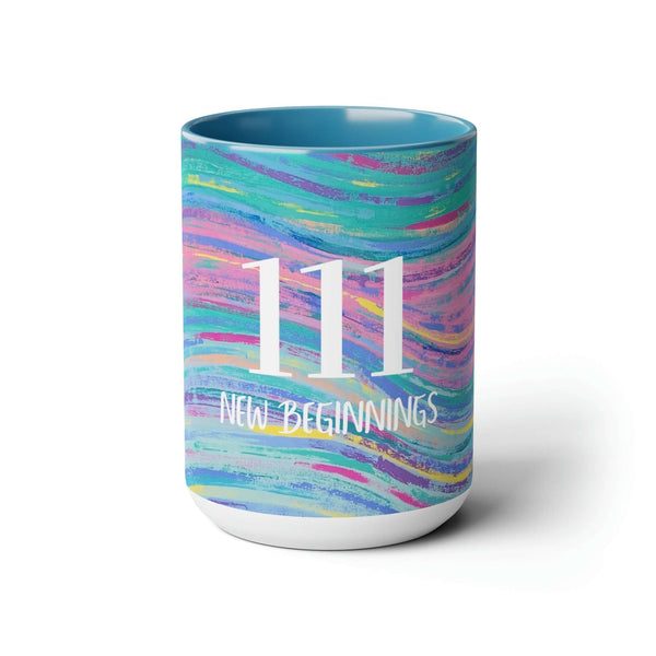 A mug with the angel number 111 and the words new beginnings and it includes colorful abstract art